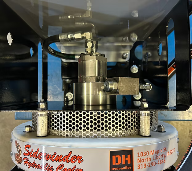 Side view of DH Hydraulics Single Cool Pack showing reservoir, heat exchanger fan housing, and hydraulic hose connections on frame mount bracket.